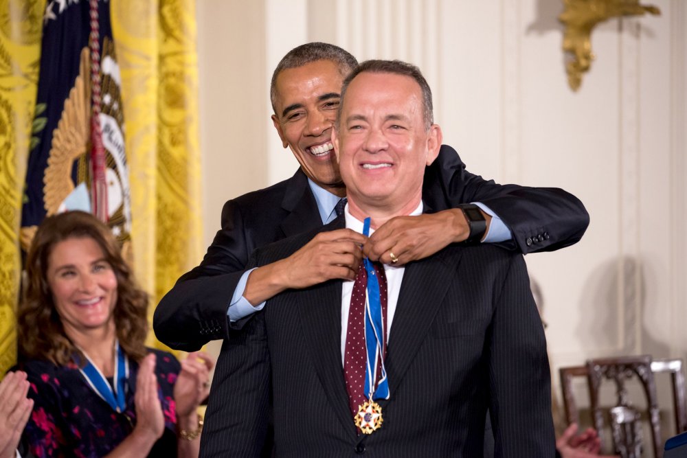 Hanks being decorated by former US President Barack Obama/Image Source: The New York Times