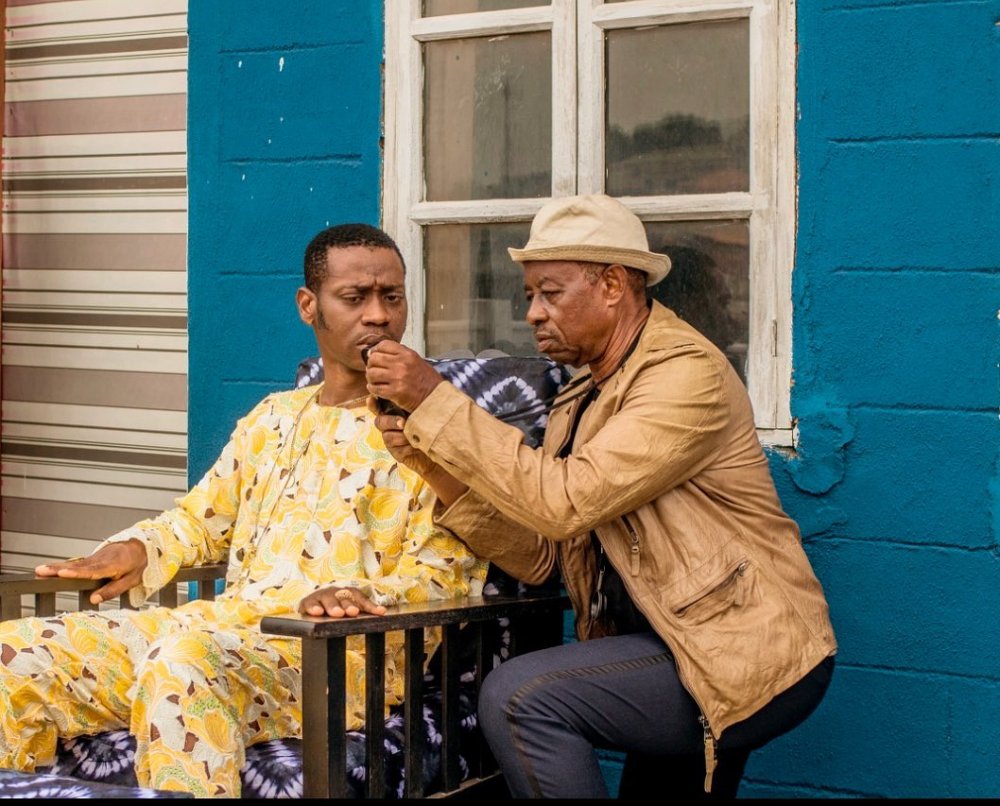 Adedimeji Lateef and director Tunde Kelani on the set of AYINLA | Image Source: Instagram